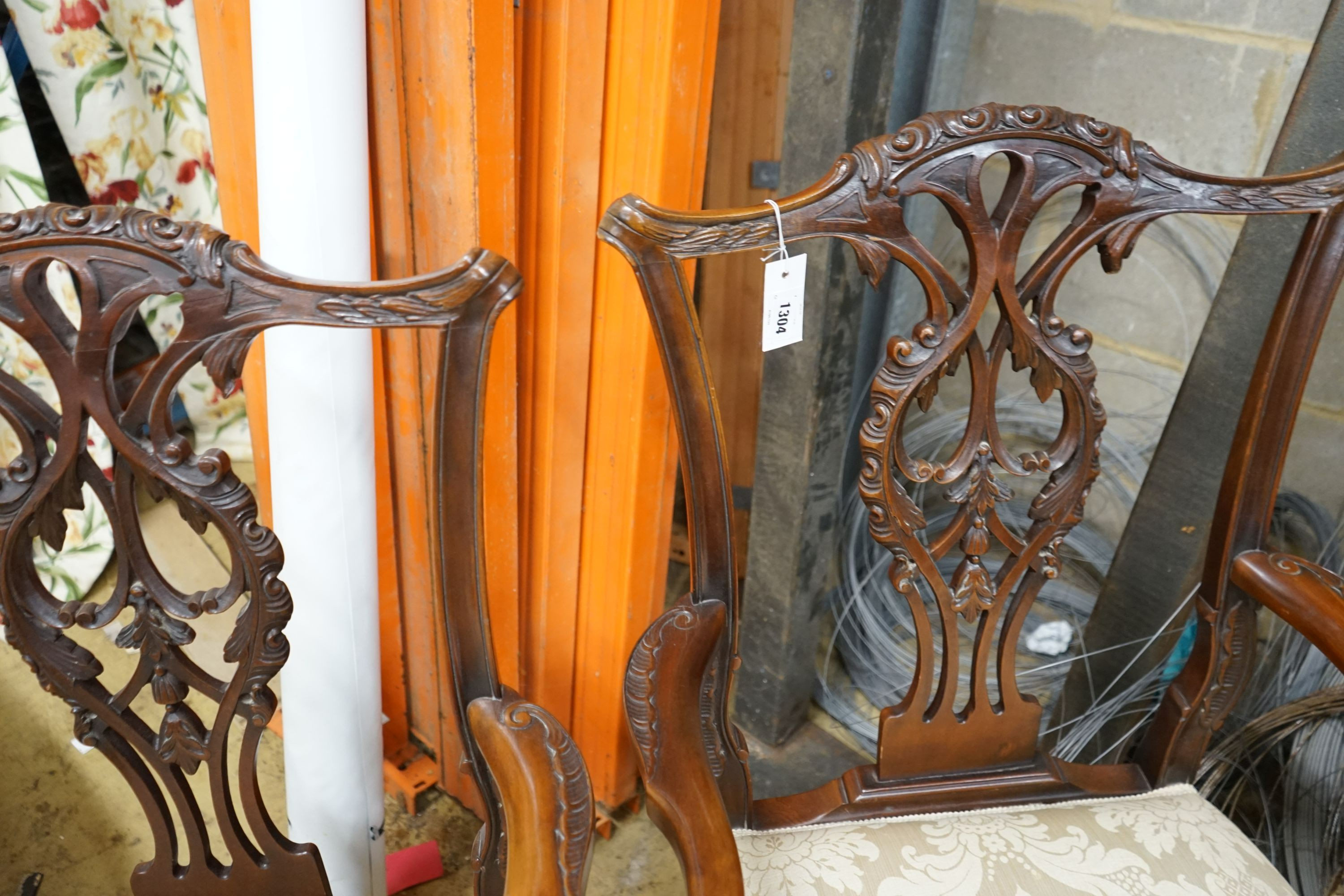 A pair of Chippendale revival mahogany elbow chairs, width 60cm, depth 50cm, height 102cm